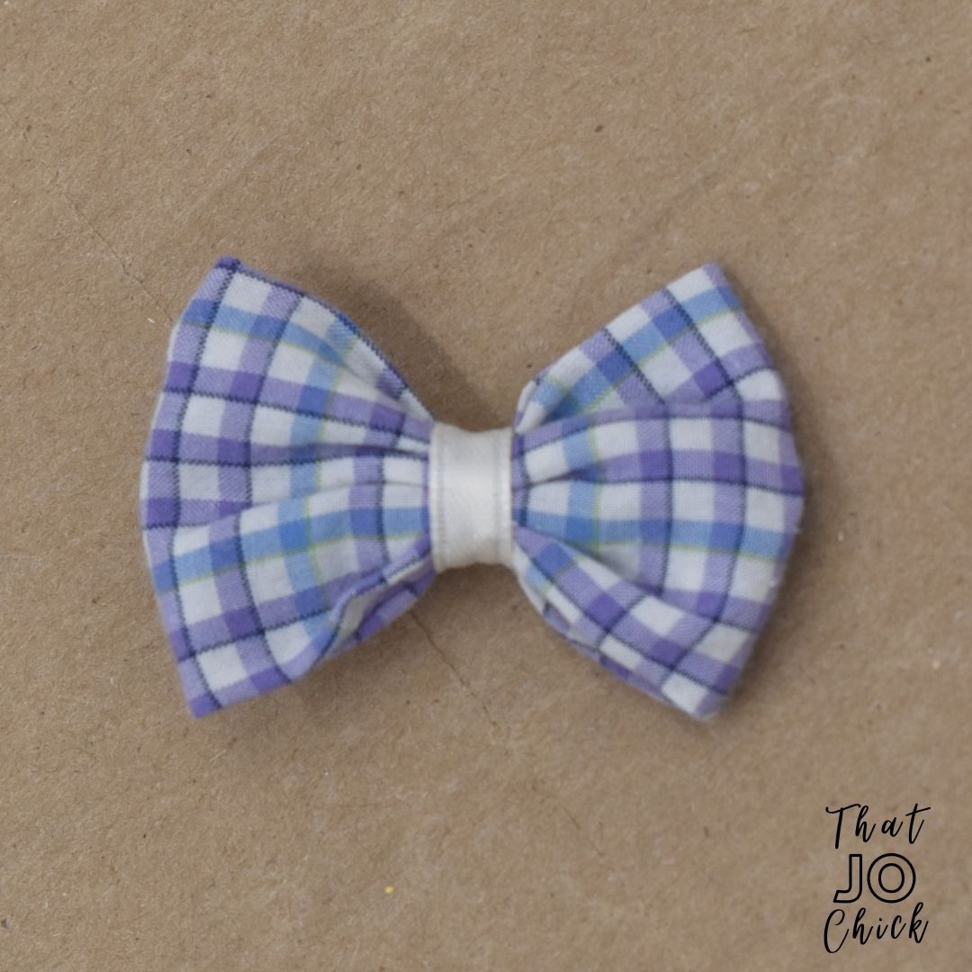 This girl's purple plaid hair bow is a one-of-a-kind, hand-crafted item.