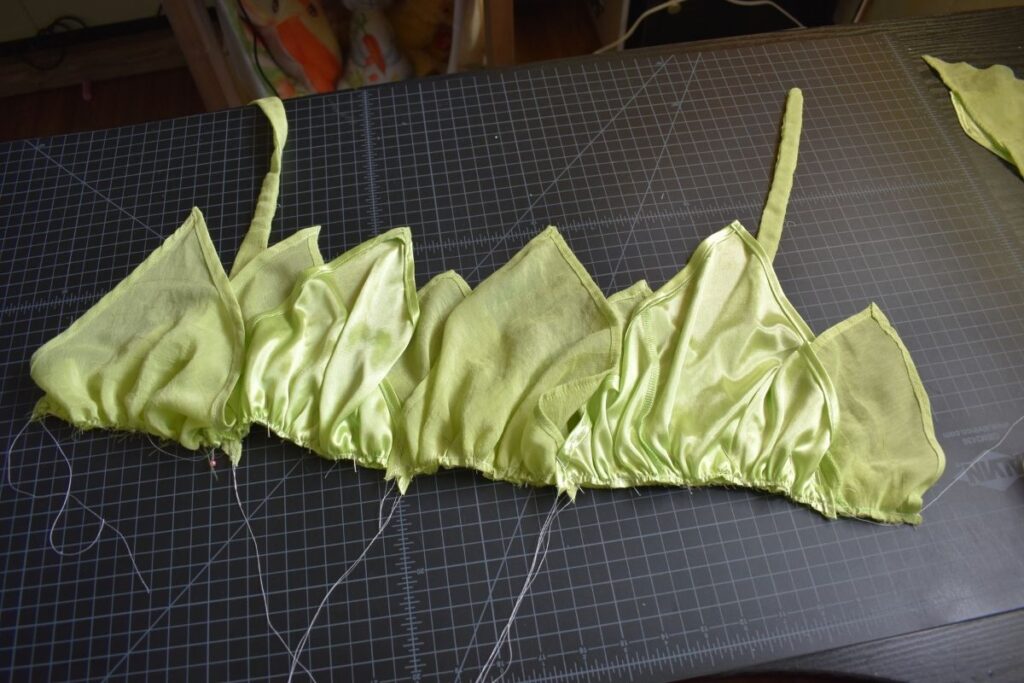 Attaching the "leaves" for the Tinkerbell costume skirt