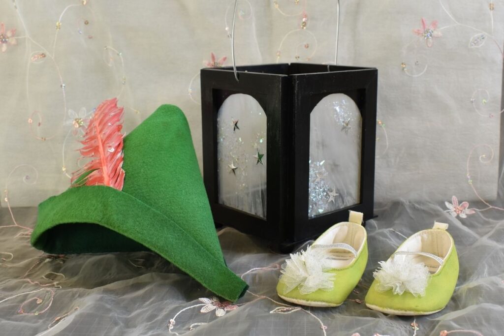 Tinkerbell's lantern, painted fairy shoes, and peter pan's hat