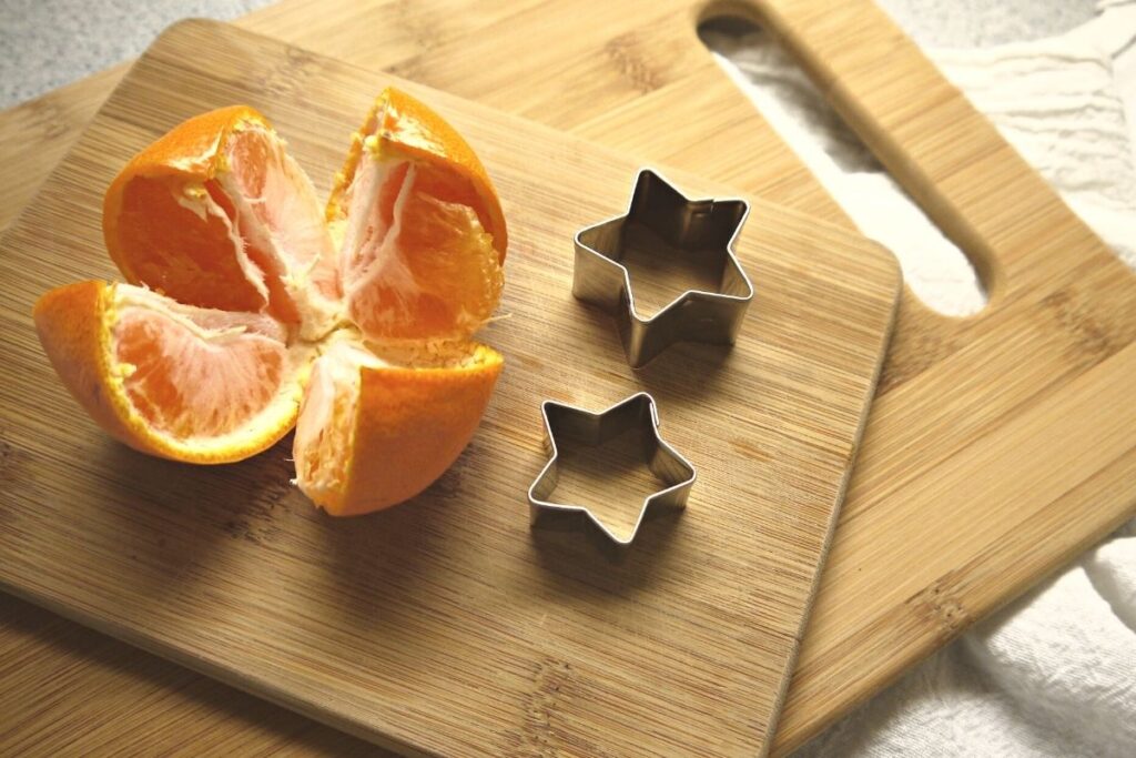 orange peel stars showing cut orange and metal cutters