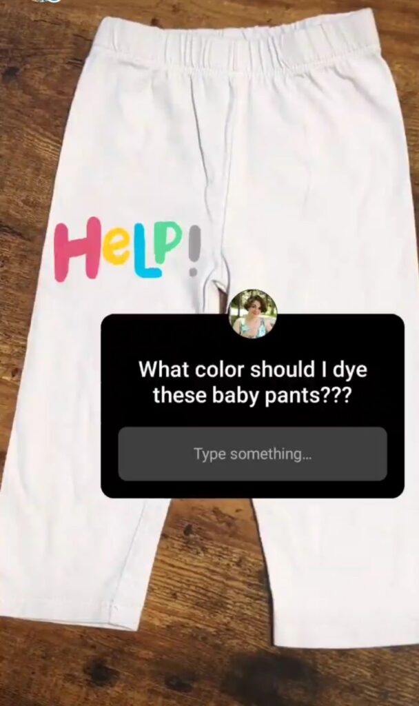 Plain white baby pants with IG story question. "what color should I dye these pants?"